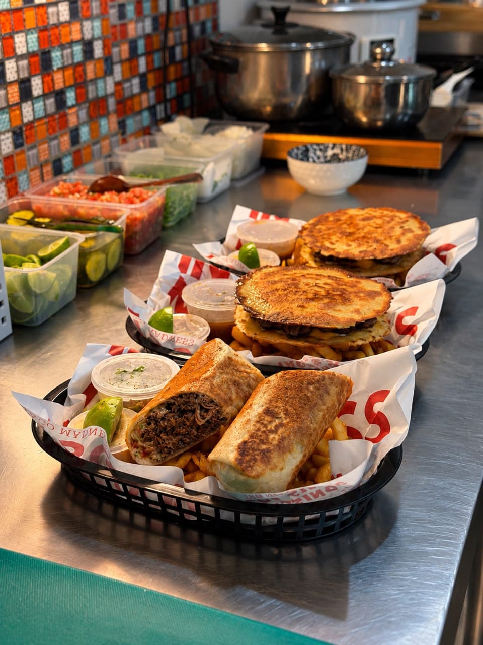 Beef birria burrito and smash NZ beef tacos with curly fries