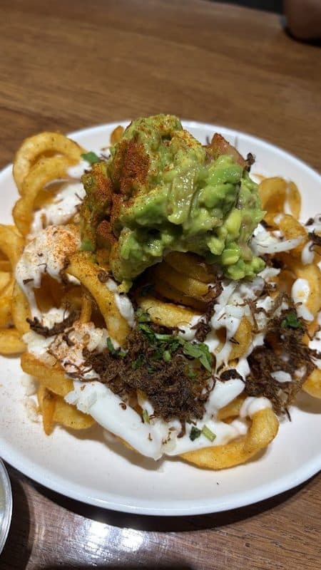 Kelvin S. Dolinting's photo of loaded curly fries with guacamole